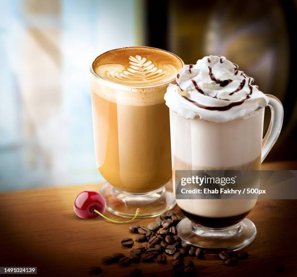 close-up of coffee in glasses on table - blended coffee drink stock pictures, royalty-free photos & images