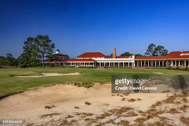 View of the green on the par 4, 18th hole with the clubhouse behind on the Pinehurst No.2 Course which will be the host course for the 2024 US Open...