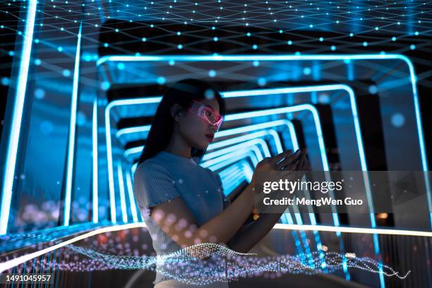 technology particles and luminescent glasses - digital composite stock pictures, royalty-free photos & images