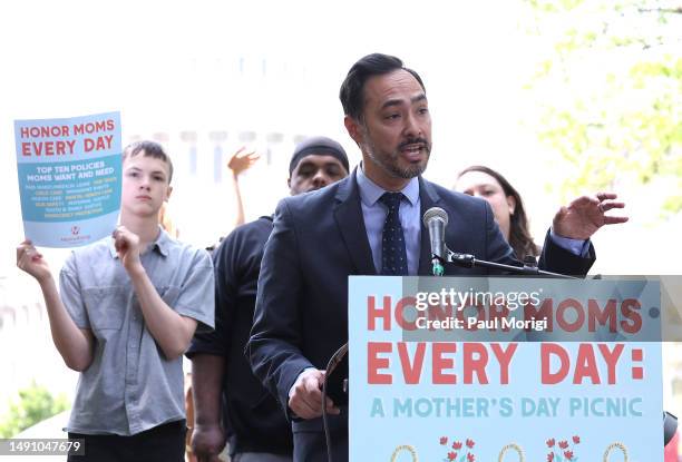 Rep. Joaquin Castro joins MomsRising members and their kids at a picnic on Capitol Hill to urge Congress to make child care affordable, pass paid...