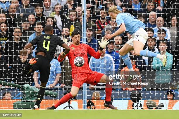 Erling Haaland of Manchester City has a shot saved by Thibaut Courtois of Real Madrid during the UEFA Champions League semi-final second leg match...