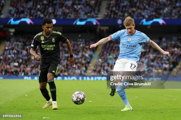 Kevin De Bruyne of Manchester City crosses the ball past Rodrygo of Real Madrid during the UEFA Champions League semi-final second leg match between...