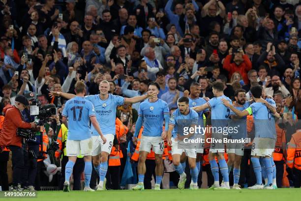 Manuel Akanji of Manchester City celebrates with teammates after scoring the team's third goal during the UEFA Champions League semi-final second leg...