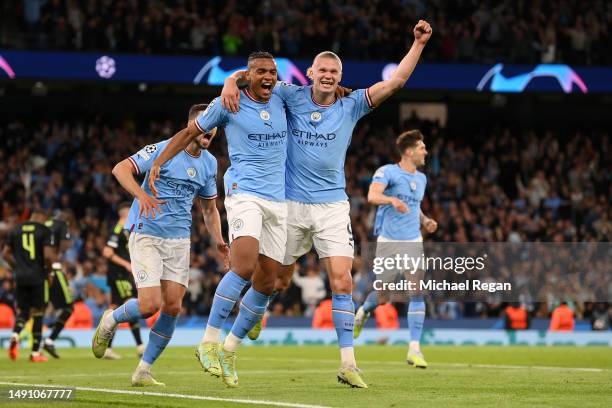 Manuel Akanji celebrates with Erling Haaland of Manchester City after scoring the team's third goal during the UEFA Champions League semi-final...