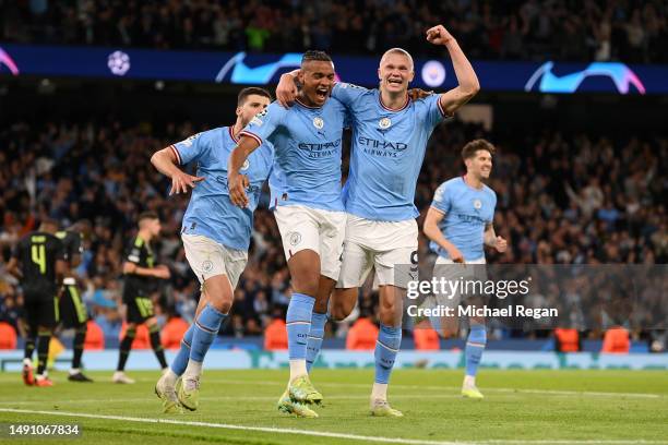 Manuel Akanji celebrates with Erling Haaland of Manchester City after scoring the team's third goal during the UEFA Champions League semi-final...