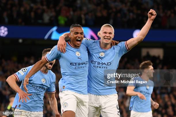 Manuel Akanji celebrates with Erling Haaland of Manchester City after an own goal by Eder Militao of Real Madrid Manchester City's third goal during...