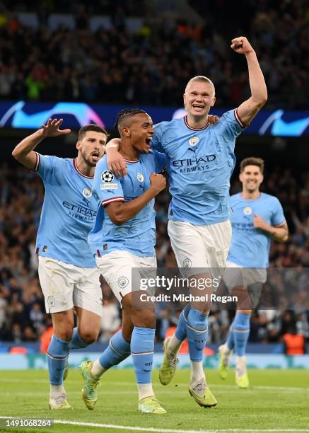 Manuel Akanji celebrates with Erling Haaland of Manchester City after an own goal by Eder Militao of Real Madrid Manchester City's third goal during...