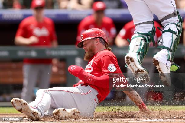Jake Fraley of the Cincinnati Reds scores on a Luke Maile double against the Colorado Rockies in the second inning at Coors Field on May 17, 2023 in...