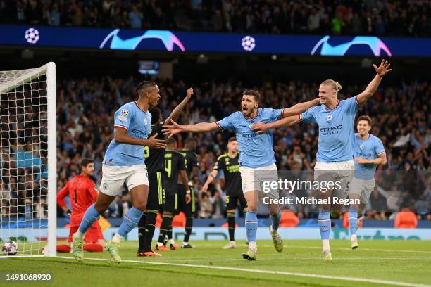 Manuel Akanji celebrates with Erling Haaland of Manchester City after an own goal by Eder Militao of Real Madrid Manchester City's third goal during...