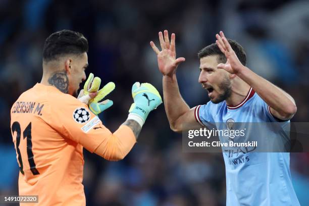 Ederson and Ruben Dias of Manchester City celebrate after the team's victory during the UEFA Champions League semi-final second leg match between...