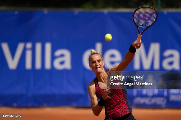 Arantxa Rus of Netherlands plays a forehand in her first round doubles match against Emily Appleton of Great Britain and Bibiane Schoofs of...