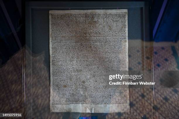 One of only four surviving Magna Carta documents from 1215 is seen on display at Salisbury Cathedral, on May 17, 2023 in Salisbury, England. The...