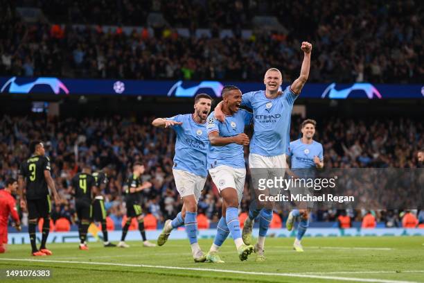 Manuel Akanji celebrates with Erling Haaland of Manchester City after scoring the team's third goal during the UEFA Champions League semi-final...
