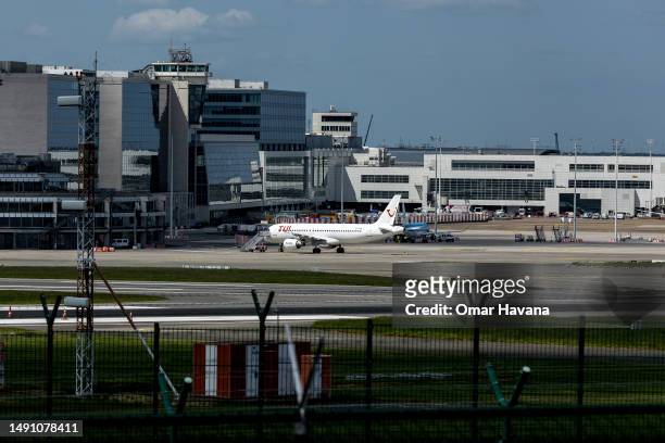Airline plane is seen parked at its designated departure gate at the airport of the Belgian capital on May 17, 2023 in Brussels, Belgium. Brussels...