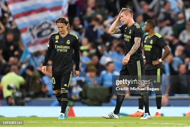 Luka Modric and Toni Kroos of Real Madrid react after Bernardo Silva of Manchester City scored their sides second goal during the UEFA Champions...