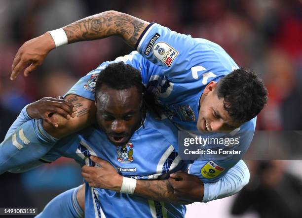 Coventry player Gustavo Hamer celebrates on the shoulders of Fankaty Dabo after the Sky Bet Championship Play-Off Semi-Final Second Leg match between...