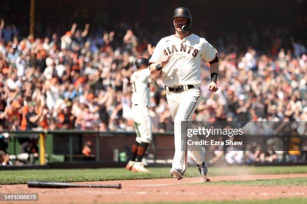 Mitch Haniger of the San Francisco Giants runs home to score against the Philadelphia Phillies in the eighth inning at Oracle Park on May 17, 2023 in...