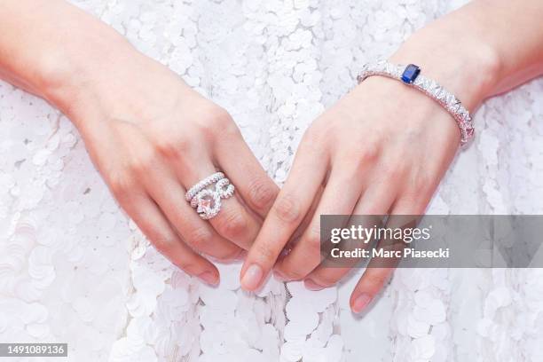 Gemma Chan, ring detail, attends the "Monster" red carpet during the 76th annual Cannes film festival at Palais des Festivals on May 17, 2023 in...
