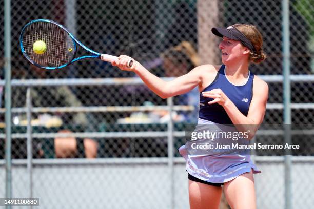 Manon Leonard of France plays a forehand during her first round match against Carolina Alves of Brazil during the 2023 ITF World Tennis Tour W60...