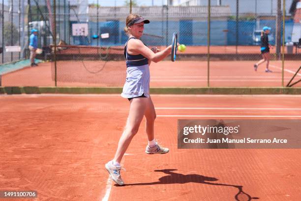 Manon Leonard of France plays a forehand during her first round match against Carolina Alves of Brazil during the 2023 ITF World Tennis Tour W60...