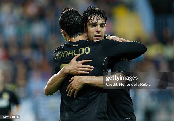 Cristiano Ronaldo of Real Madrid celebrates with Kaka after scoring during the La Liga match between Malaga CF and Real Madrid CF at Estadio La...