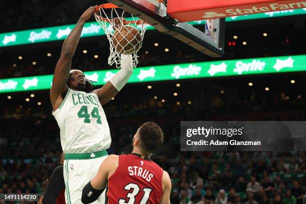 Robert Williams III of the Boston Celtics dunks in front of Max Strus of the Miami Heat during the first quarter of game one of the Eastern...