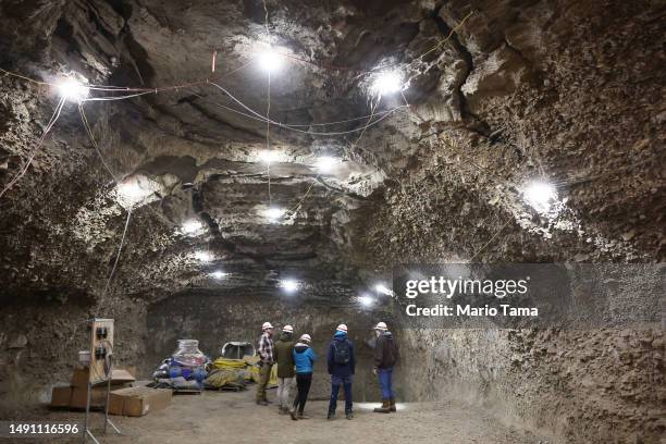 In this image released on May 17 NASA SnowEx campaign researchers and pilots tour the Permafrost Tunnel Research Facility, which contains 18,000 to...