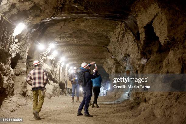 In this image released on May 17 NASA SnowEx campaign researchers and pilots tour the Permafrost Tunnel Research Facility, which contains 18,000 to...