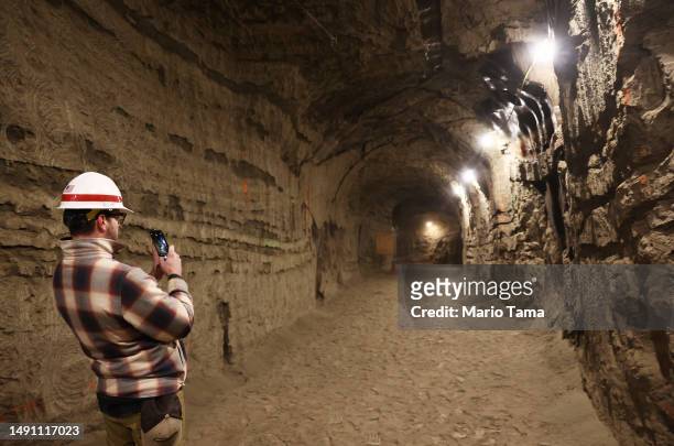 In this image released on May 17 NASA SnowEx campaign researcher John Chapman, technologist, tours the Permafrost Tunnel Research Facility, which...
