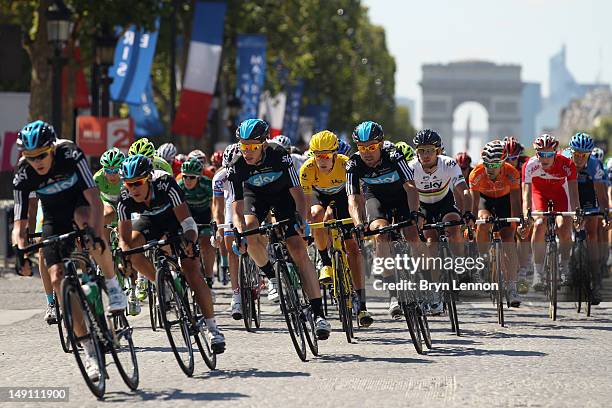 Bradley Wiggins of Great Britain and SKY Procycling rides flanked by teamtes during the twentieth and final stage of the 2012 Tour de France, from...