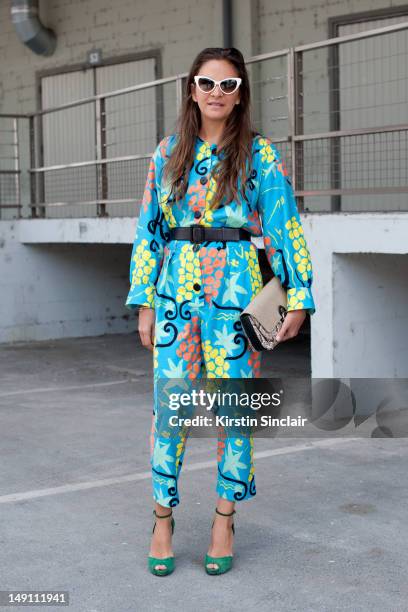 Laure Heriard Dubreuil store owner, wearing Pierre Hardy shoes, vintage YSL jumpsuit, Balenciaga bag, and Tom Ford sunglasses at Paris Fashion Week...