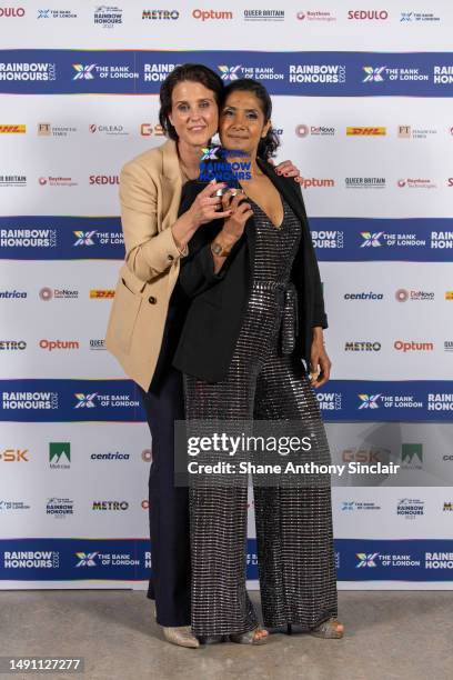 Actors Heather Peace and Balvinder Sopal of "Eastenders" pose in the winners room with the Media Moment Of The Year Award during the Rainbow Honours...