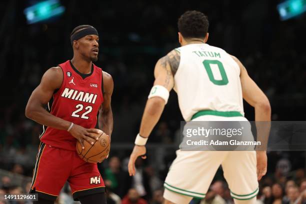 Jimmy Butler of the Miami Heat is defended by Jayson Tatum of the Boston Celtics during the third quarter of game one of the Eastern Conference...