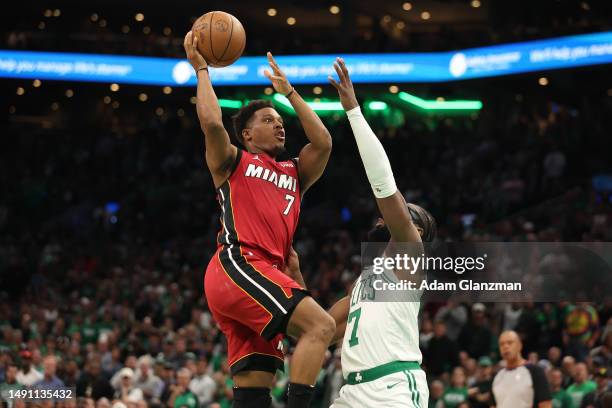 Kyle Lowry of the Miami Heat drives to the basket against Jaylen Brown of the Boston Celtics during the fourth quarter of game one of the Eastern...