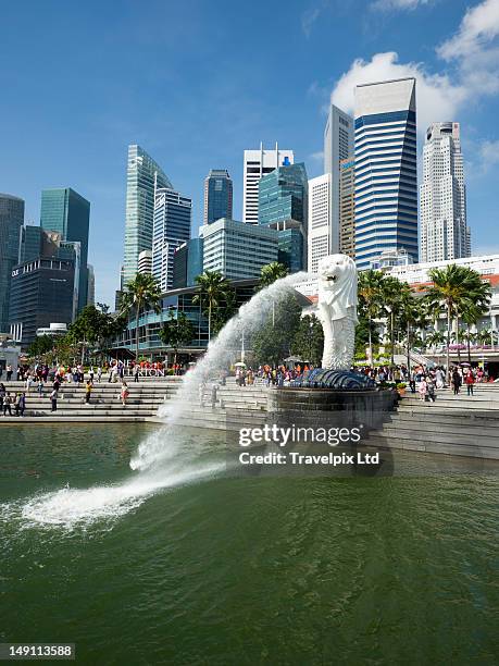 merlion park and singapore skyline, marina bay - merlion statue stock pictures, royalty-free photos & images