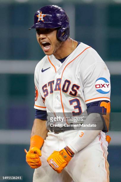 Jeremy Pena of the Houston Astros reacts to hitting a double during the ninth inning against the Chicago Cubs at Minute Maid Park on May 17, 2023 in...