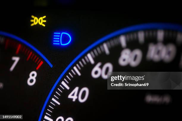 the dashboard glows from the car. - domestic car fotografías e imágenes de stock