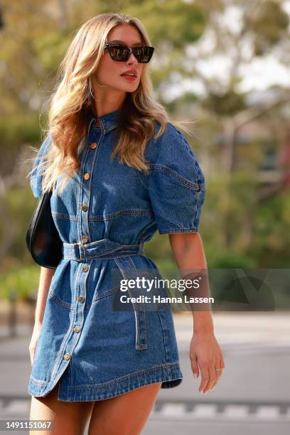 Harmony Butcher wearing Acler denim mini dress at Afterpay Australian Fashion Week 2023 at Carriageworks on May 18, 2023 in Sydney, Australia.