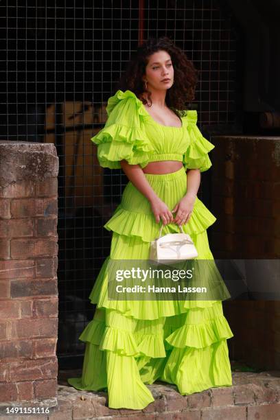 Guest wearing neon cropped top and maxi skirt at Afterpay Australian Fashion Week 2023 at Carriageworks on May 18, 2023 in Sydney, Australia.