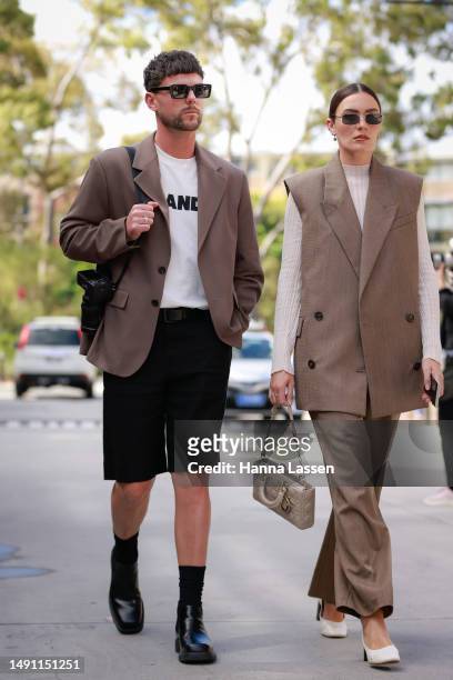 Holly Lyle wearing brown oversized vest suit and Dior bag at Afterpay Australian Fashion Week 2023 at Carriageworks on May 18, 2023 in Sydney,...