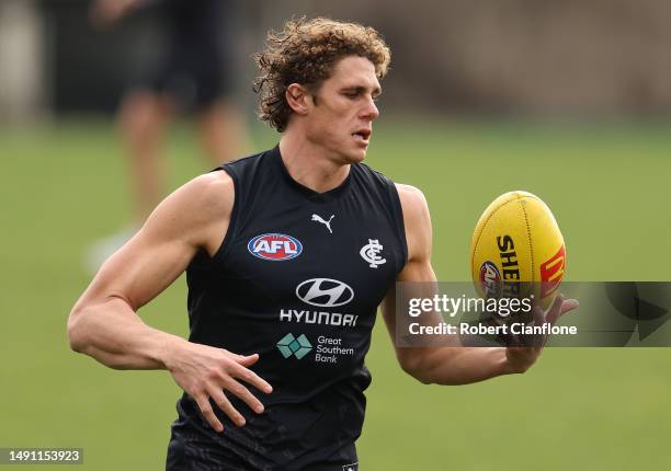 Charlie Curnow of the Blues controls the ball during a Carlton Blues AFL training session at Ikon Park on May 18, 2023 in Melbourne, Australia.