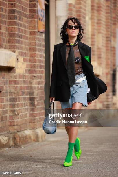 Charlene Davies wearing black Bottega Veneta blazer, black Prada tie, Alexandra Wang rabbit diamante special edition shirt, Culturesse jewellery,...