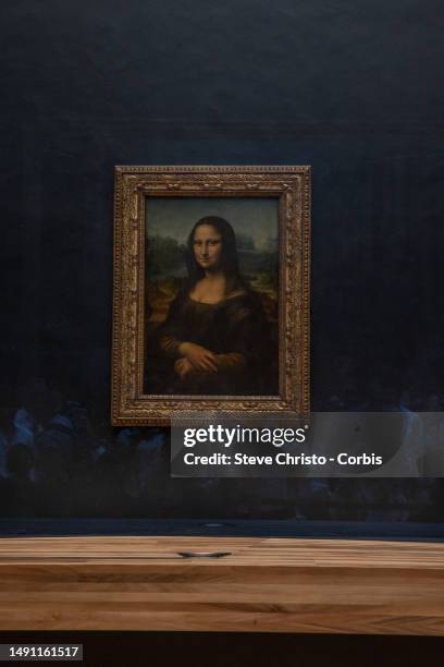 The painting "La Joconde" The Mona Lisa by Italian artist Leonardo Da Vinci on display in a gallery at The Louvre Museum in Paris, on August 22, 2022.