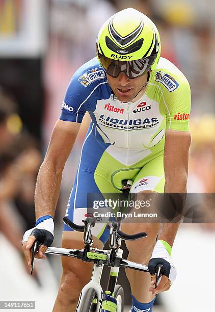 Ivan Basso of Italy and Liquigas-Cannondale crosses the finish line during stage nineteen of the 2012 Tour de France, a 53.5km time trial from...