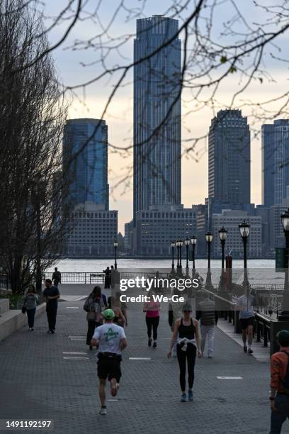 view from brookfield place / battery park, manhattan to jersey city skyline with goldman sachs tower. - battery park stock pictures, royalty-free photos & images