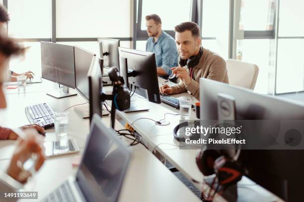 programmers in the office - software development stock pictures, royalty-free photos & images