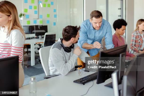 programmers in the office - software development stock pictures, royalty-free photos & images