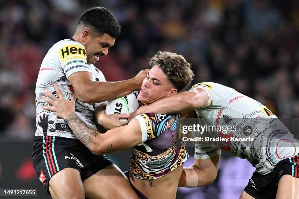 Reece Walsh of the Broncos is tackled during the round 12 NRL match between Brisbane Broncos and Penrith Panthers at Suncorp Stadium on May 18, 2023...