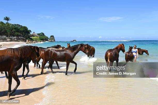 Guests ride and connect with horses in the water next to the main resort of Nihi Sumba on May 01, 2023 in Sumba, Indonesia. Judged as the best hotel...