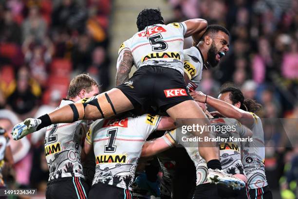 Sunia Turuva of the Panthers celebrates a try by team mate Nathan Cleary of the Panthers during the round 12 NRL match between Brisbane Broncos and...